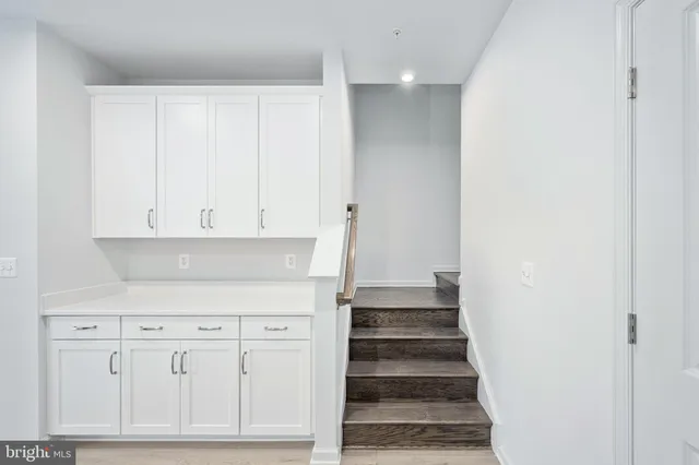 a view of an entryway with wooden floor