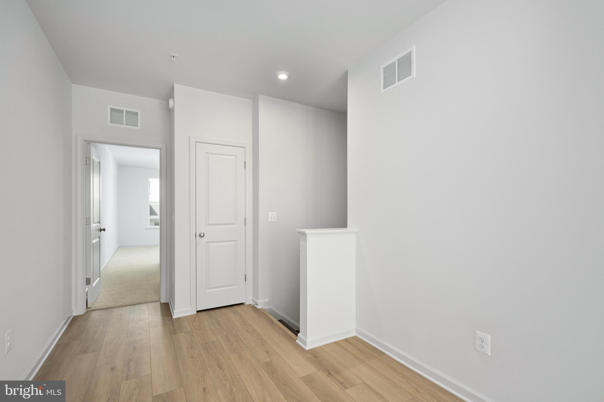 2540 Neabsco Common Place Woodbridge, VA 22191 - Photo 19 of 33 a view of an empty room with wooden floor