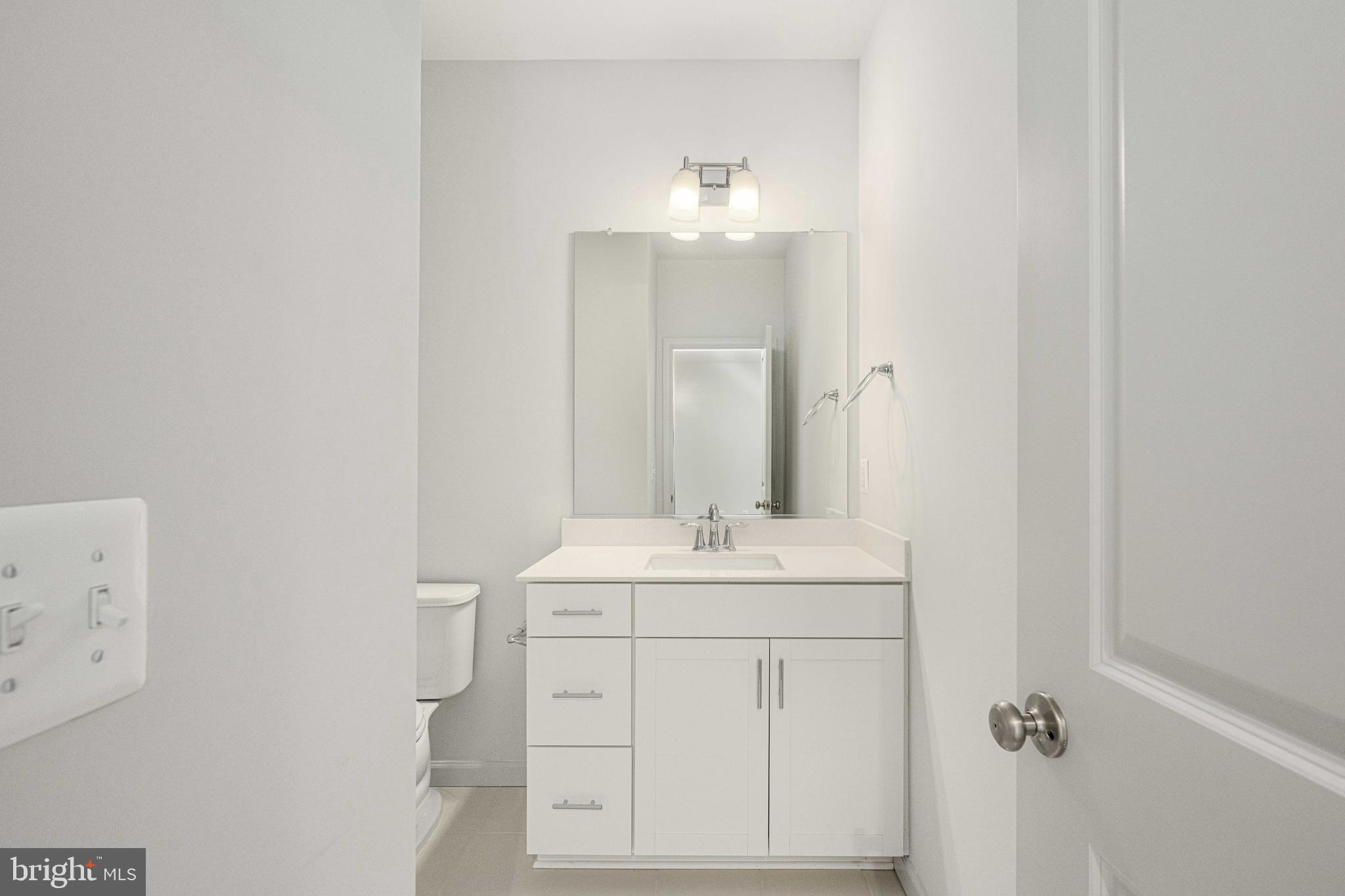 2540 Neabsco Common Place Woodbridge, VA 22191 - Photo 20 of 33 a bathroom with a sink and a mirror