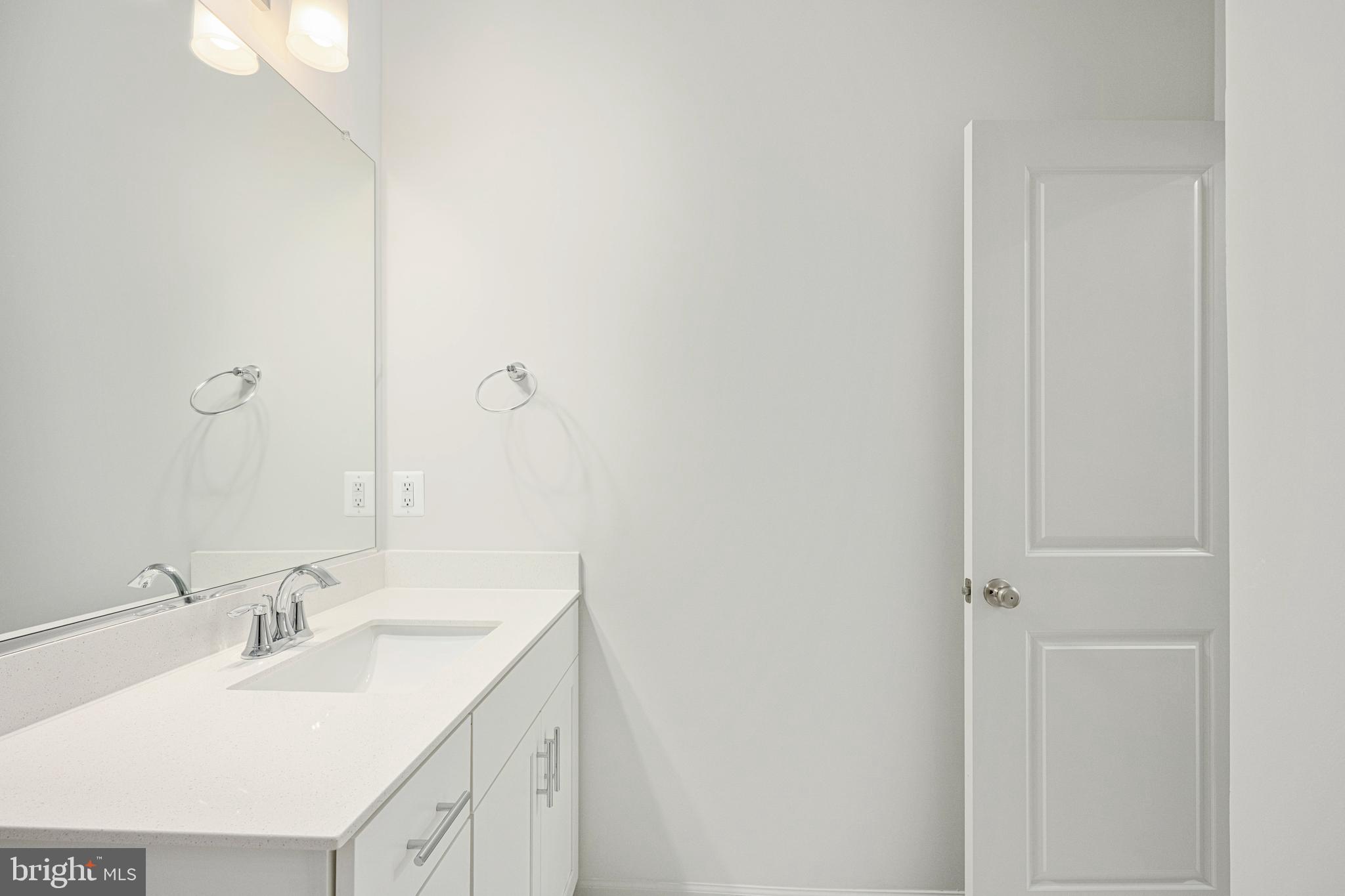 2540 Neabsco Common Place Woodbridge, VA 22191 - Photo 21 of 33 a bathroom with a double vanity sink and mirror