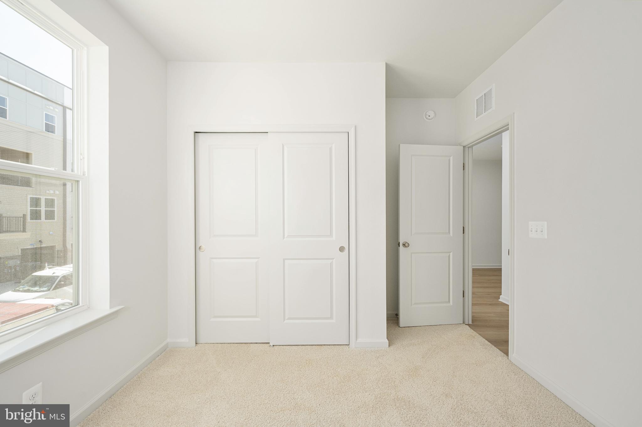 2540 Neabsco Common Place Woodbridge, VA 22191 - Photo 24 of 33 an empty room with windows