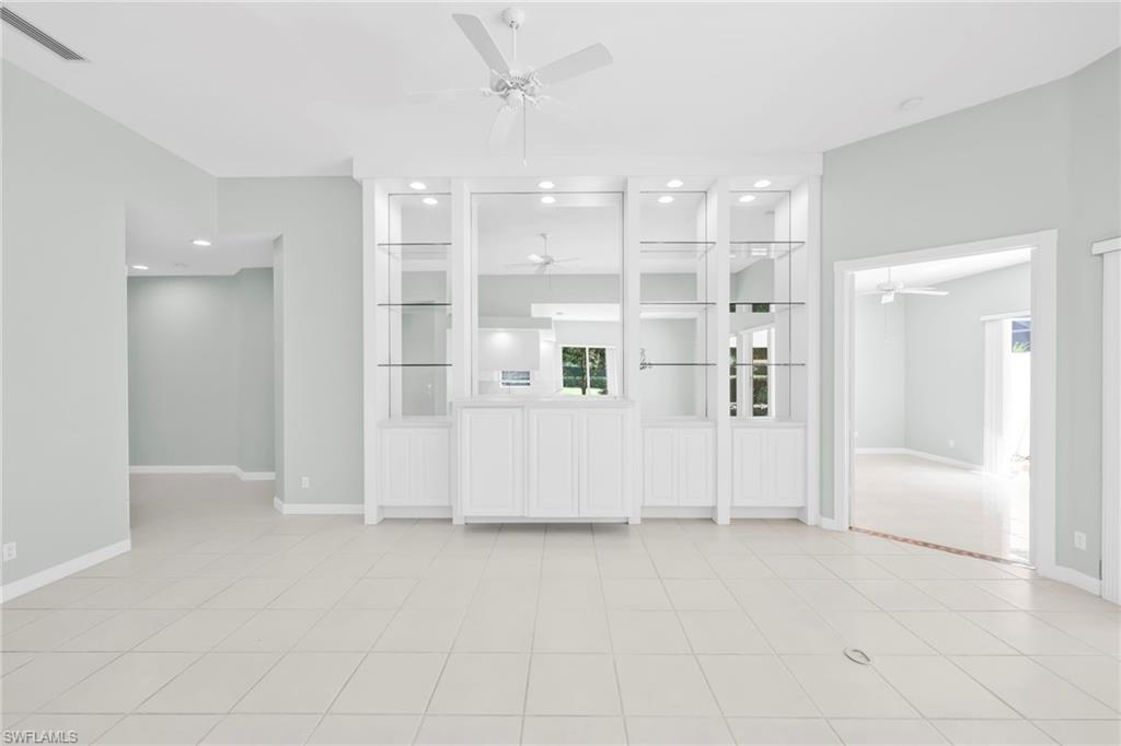 3000 Ellice Way Naples, FL 34119 - Photo 17 of 49 Living Room with built-in custom cabinets