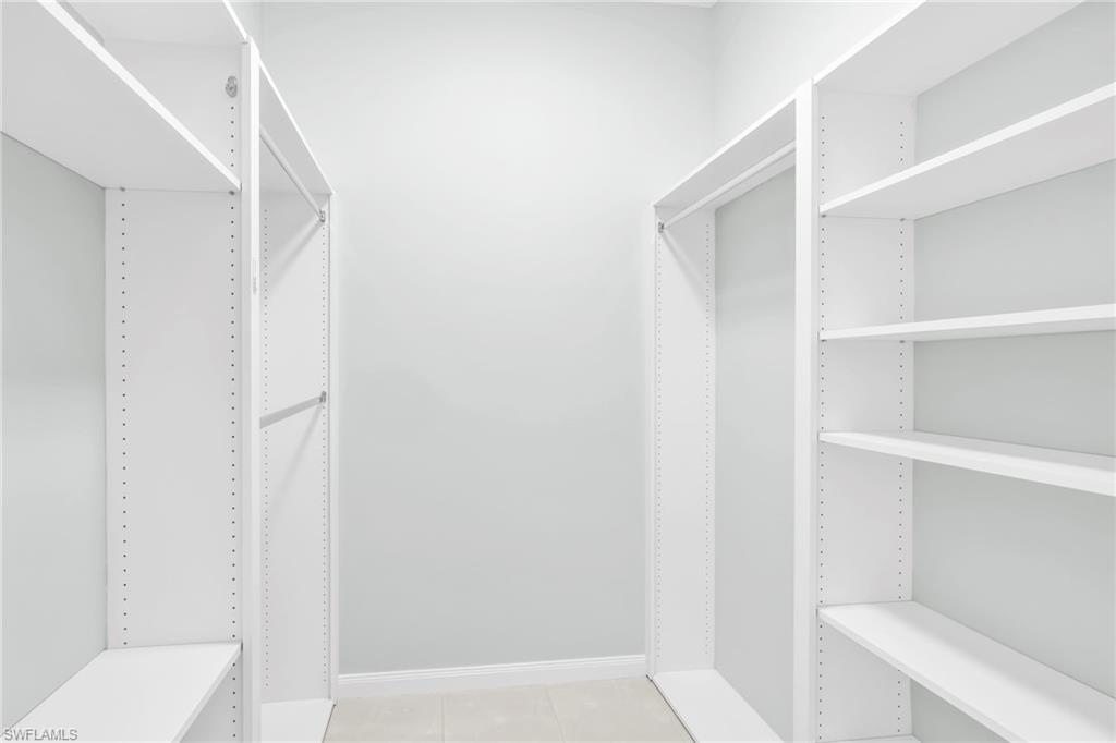 3000 Ellice Way Naples, FL 34119 - Photo 37 of 49 Custom shelving in walk-in closet