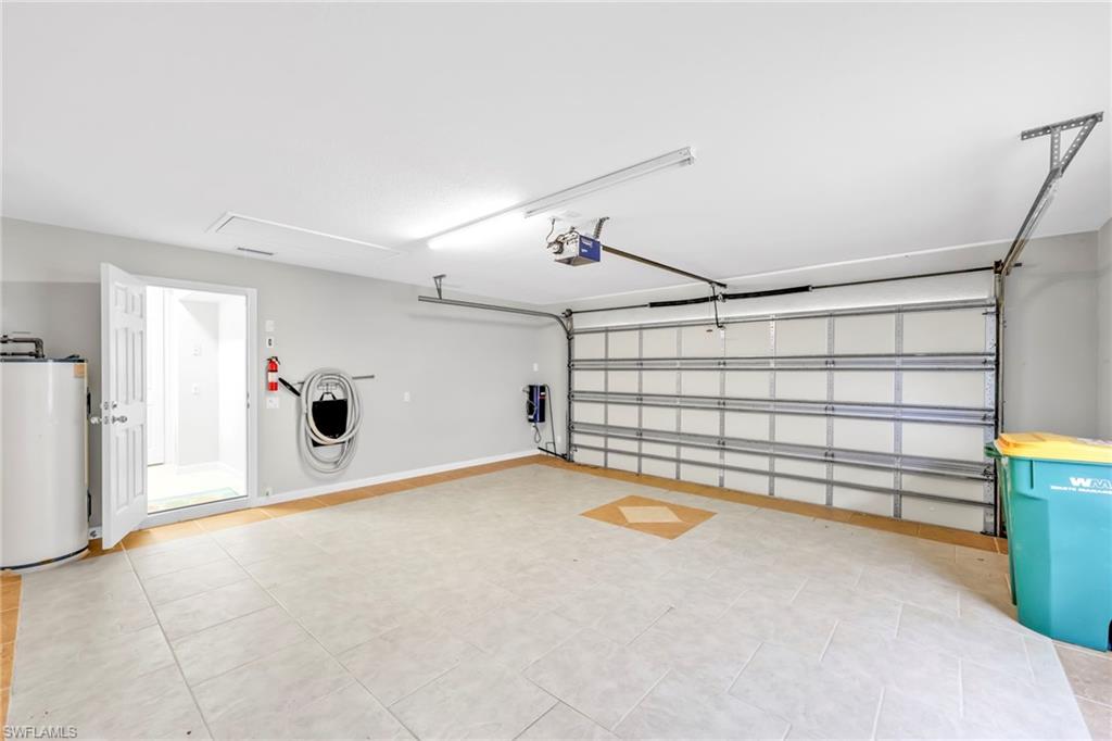 3000 Ellice Way Naples, FL 34119 - Photo 41 of 49 2-car Garage with Tile Flooring insulated garage door