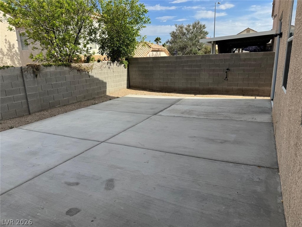 3962 Coyote Ridge Court Las Vegas, NV 89129 - Photo 2 of 35 A spacious concrete pad in a private yard, offering versatile outdoor space.