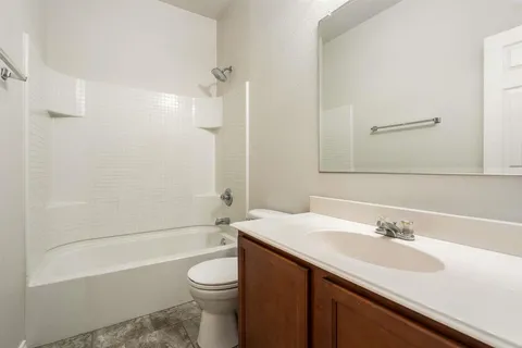 a bathroom with a sink a toilet and a bathtub
