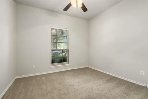 an empty room with a empty space and a window