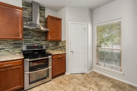 a kitchen with a stove microwave and a sink