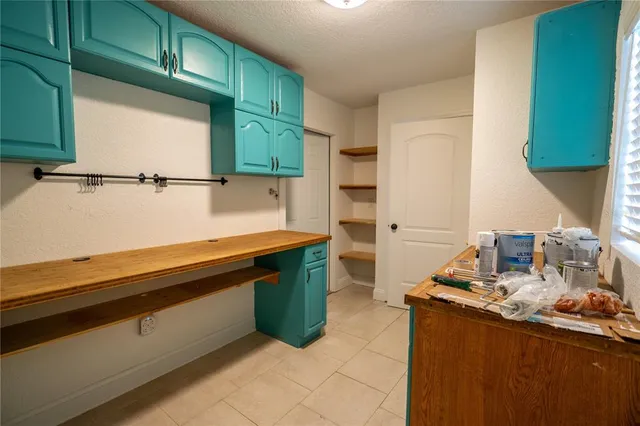 a kitchen with a sink and a microwave