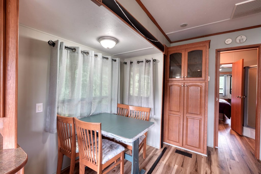 568 Parks Road Hiawassee, GA 30546 - Photo 13 of 38 a dining room with furniture and wooden floor