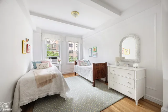 a spacious bedroom with a bed and window