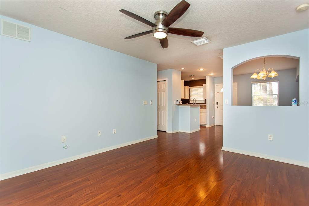 6740 Moonglow Drive, Unit 101 Port Richey, FL 34668 - Photo 17 of 39 wooden floor in an empty room with a window