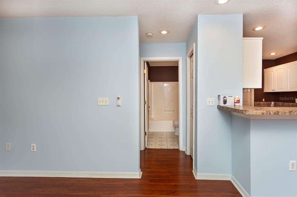 6740 Moonglow Drive, Unit 101 Port Richey, FL 34668 - Photo 21 of 39 a view of a kitchen from the hallway