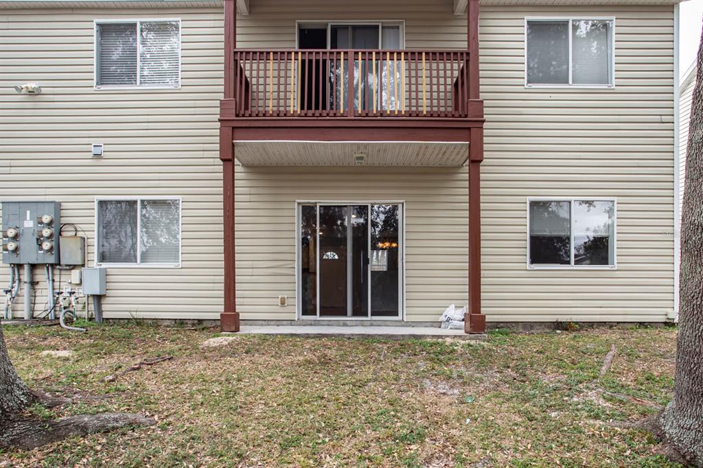 6740 Moonglow Drive, Unit 101 Port Richey, FL 34668 - Photo 35 of 39 a view of a house with a window and wooden fence