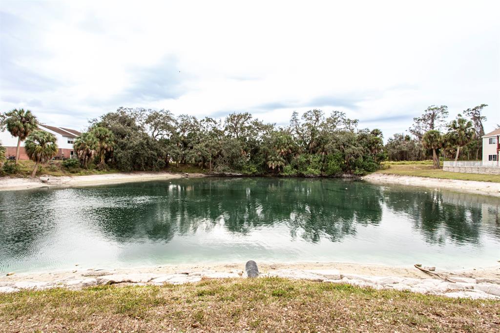 6740 Moonglow Drive, Unit 101 Port Richey, FL 34668 - Photo 39 of 39 a view of a lake view with a lake view