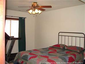 199 Sheep Ridge Road Fairplay, CO 80440 - Photo 11 of 16 a bedroom with a bed and a window