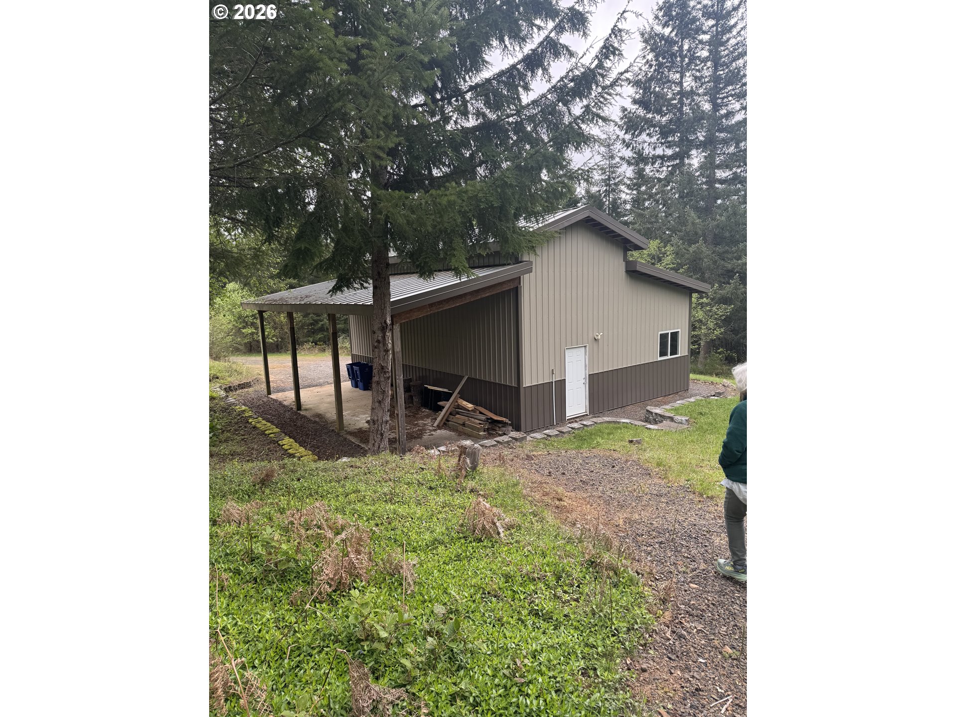 48140 Southeast Linhart Butte Road Sandy, OR 97055 - Photo 43 of 47 a backyard of a house with table and chairs
