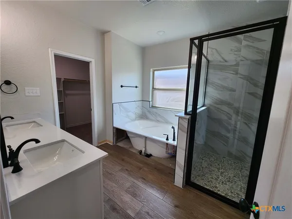 a bathroom with a sink and mirror