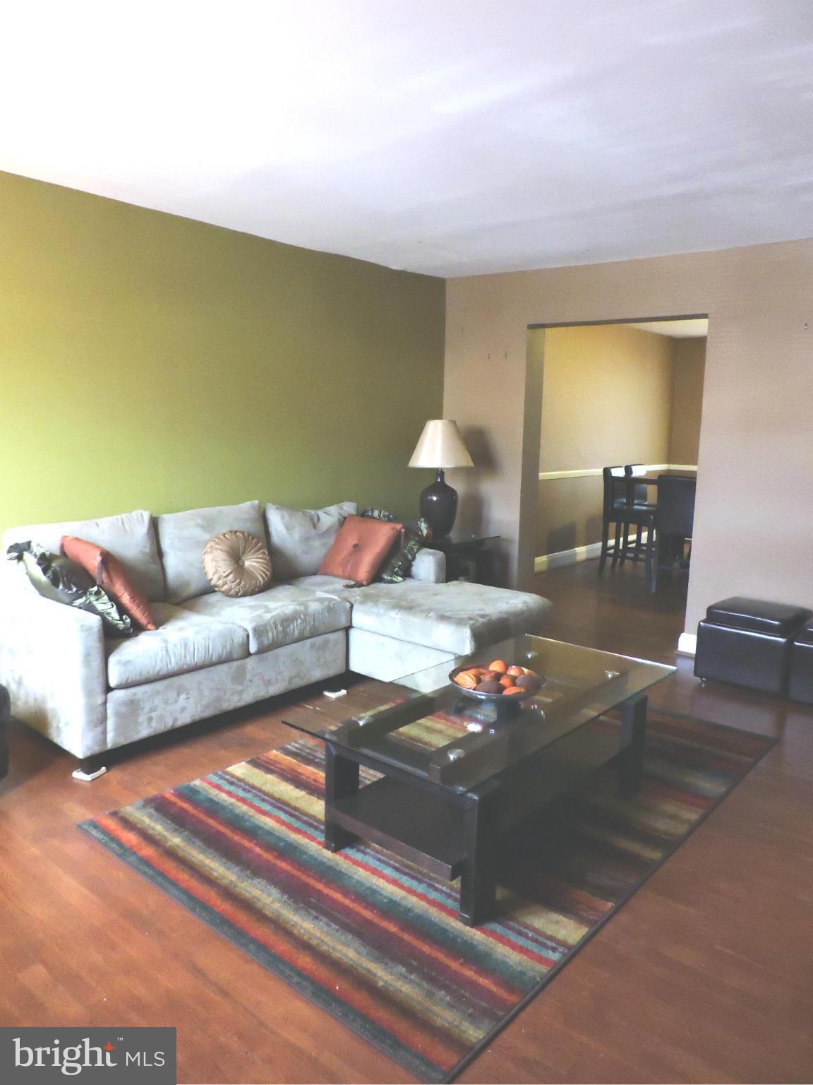 1218 Kevin Road Baltimore, MD 21229 - Photo 4 of 27 a living room with furniture and a couch
