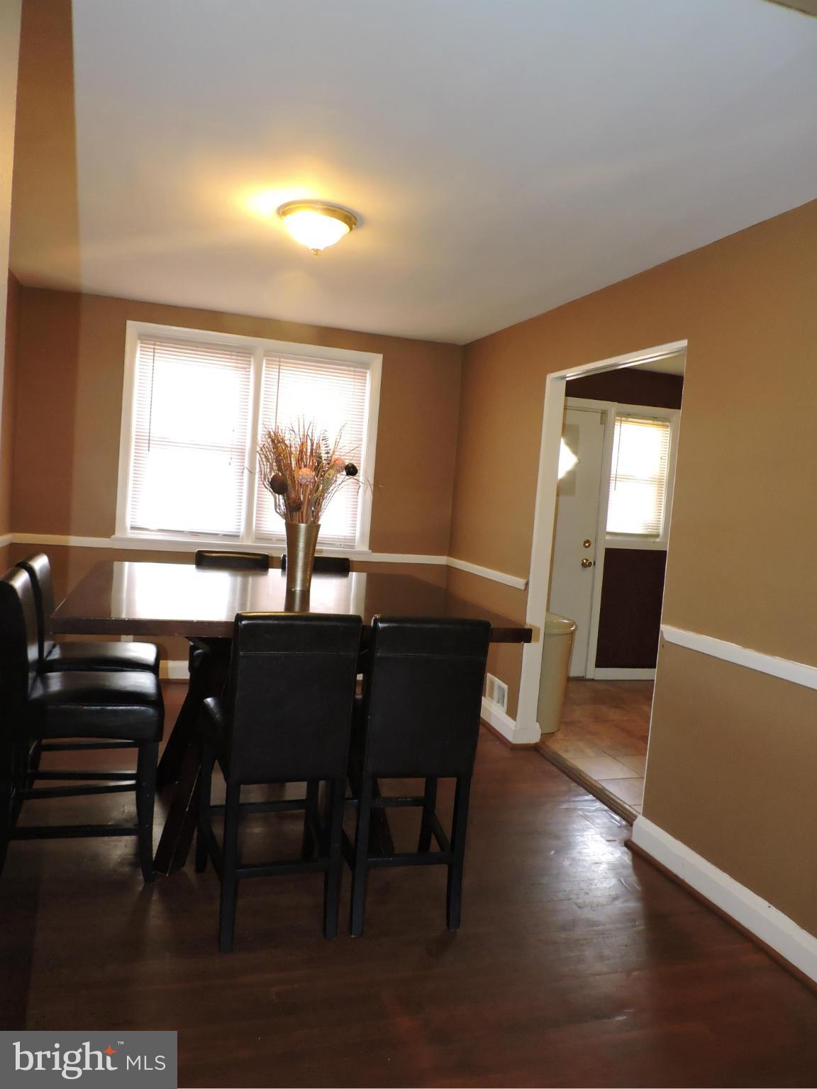 1218 Kevin Road Baltimore, MD 21229 - Photo 6 of 27 a view of a dining room with furniture and window