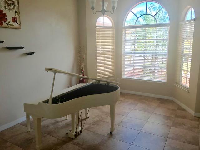 565 Southwest Homeland Road Port St. Lucie, FL 34953 - Photo 3 of 13 piano