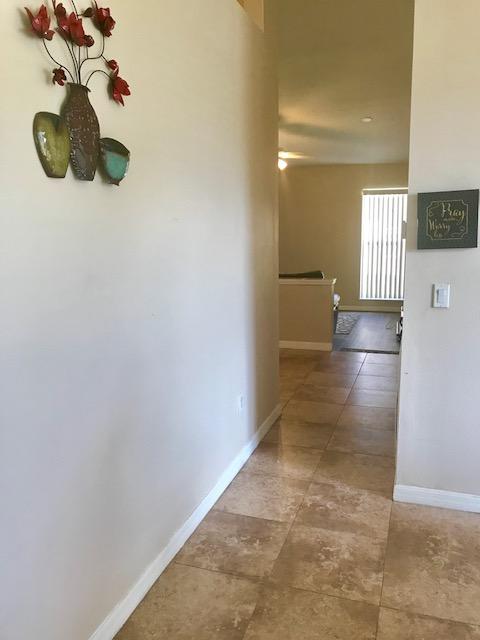 565 Southwest Homeland Road Port St. Lucie, FL 34953 - Photo 4 of 13 hallway