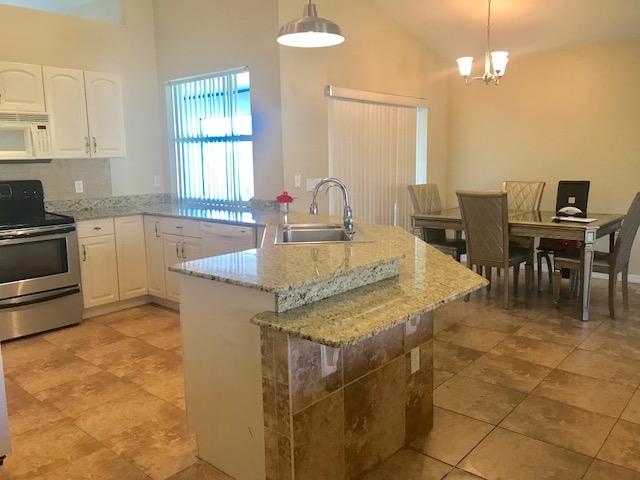 565 Southwest Homeland Road Port St. Lucie, FL 34953 - Photo 5 of 13 kitchen3