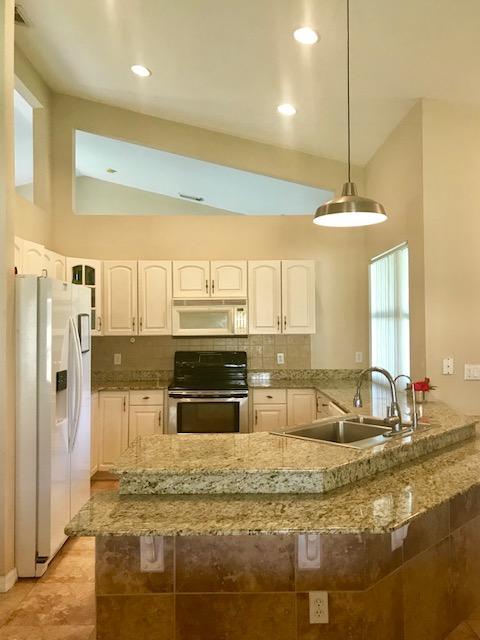 565 Southwest Homeland Road Port St. Lucie, FL 34953 - Photo 6 of 13 kitchen1