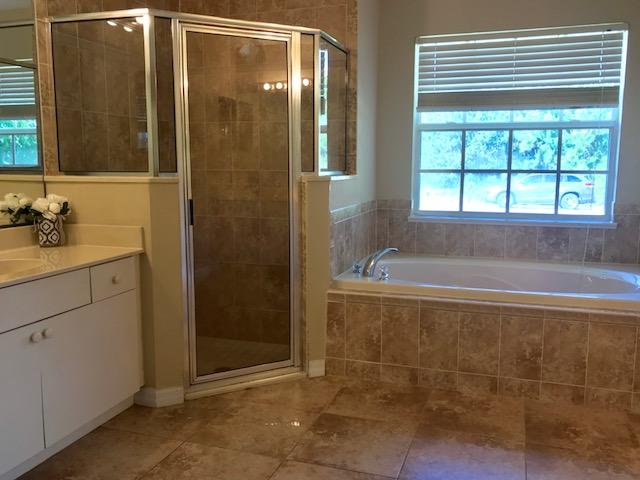 565 Southwest Homeland Road Port St. Lucie, FL 34953 - Photo 8 of 13 master bathroom1
