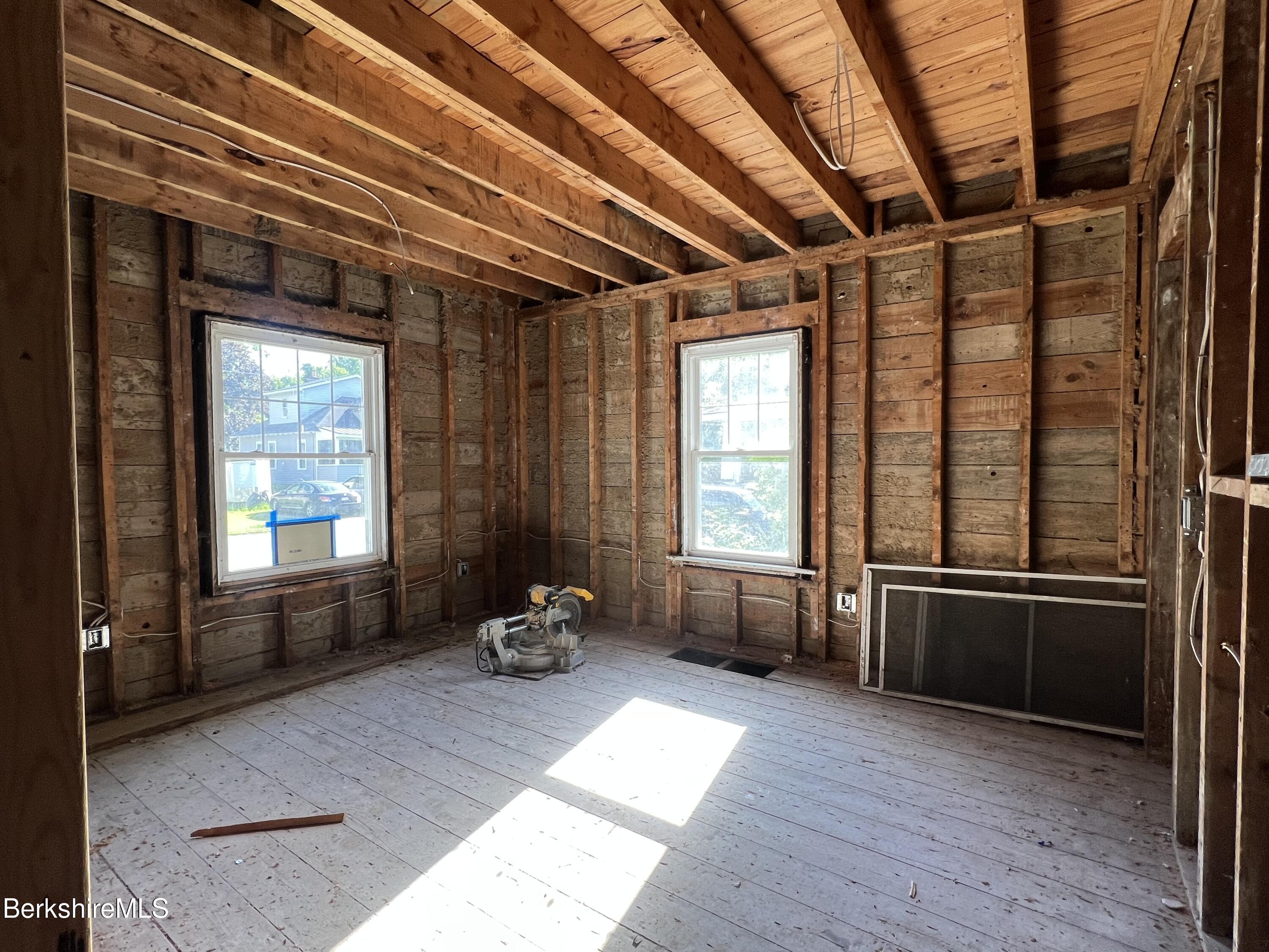 100 Boylston Street Pittsfield, MA 01201 - Photo 14 of 32 a room with wooden floor and furniture