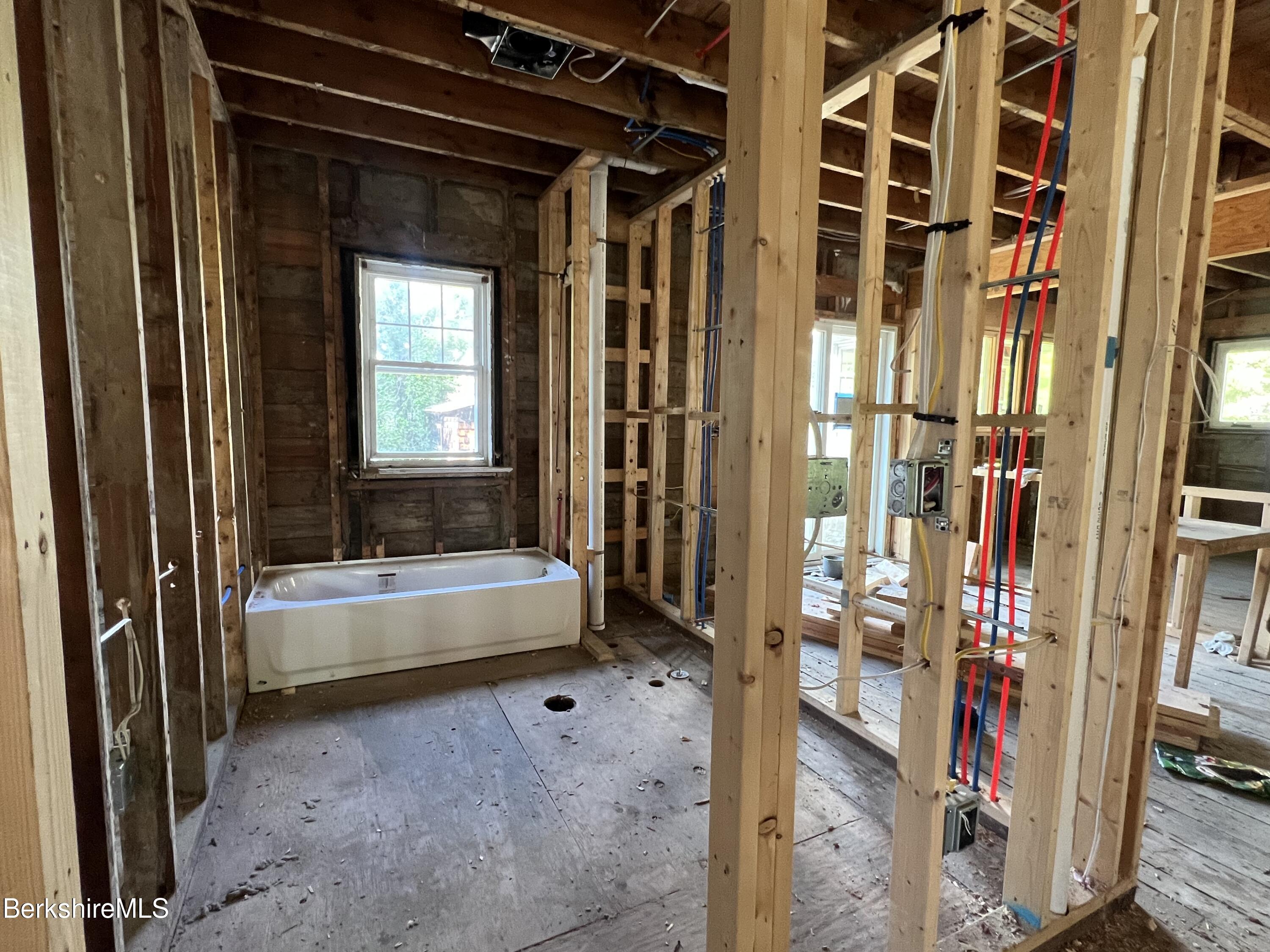 100 Boylston Street Pittsfield, MA 01201 - Photo 15 of 32 a bathroom with a tub and shower