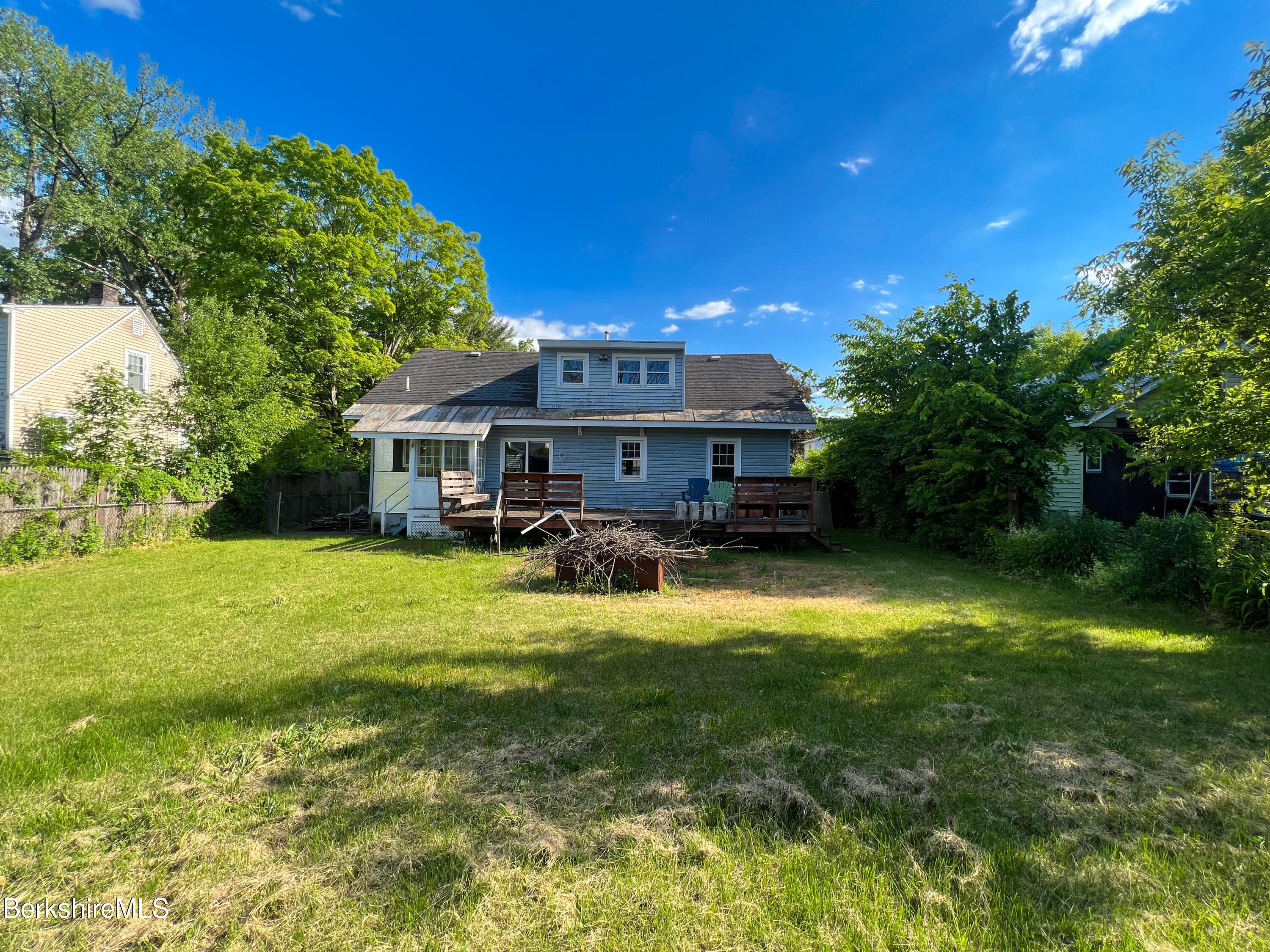 100 Boylston Street Pittsfield, MA 01201 - Photo 25 of 32 a view of a house with a big yard potted plants and large tree