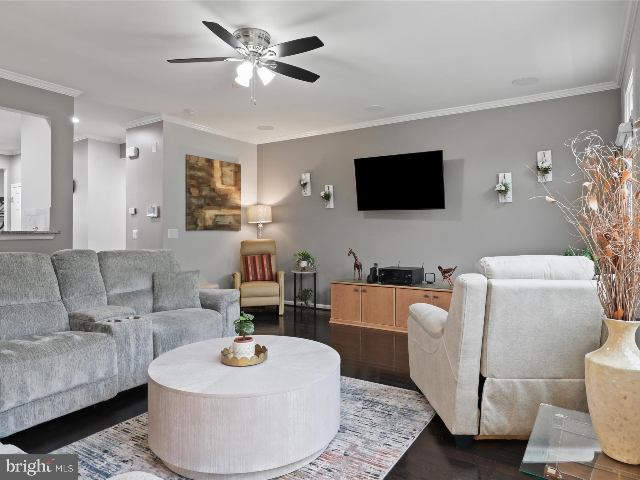 16006 Madison Ridge Place Gainesville, VA 20155 - Photo 12 of 48 a living room with furniture and a flat screen tv