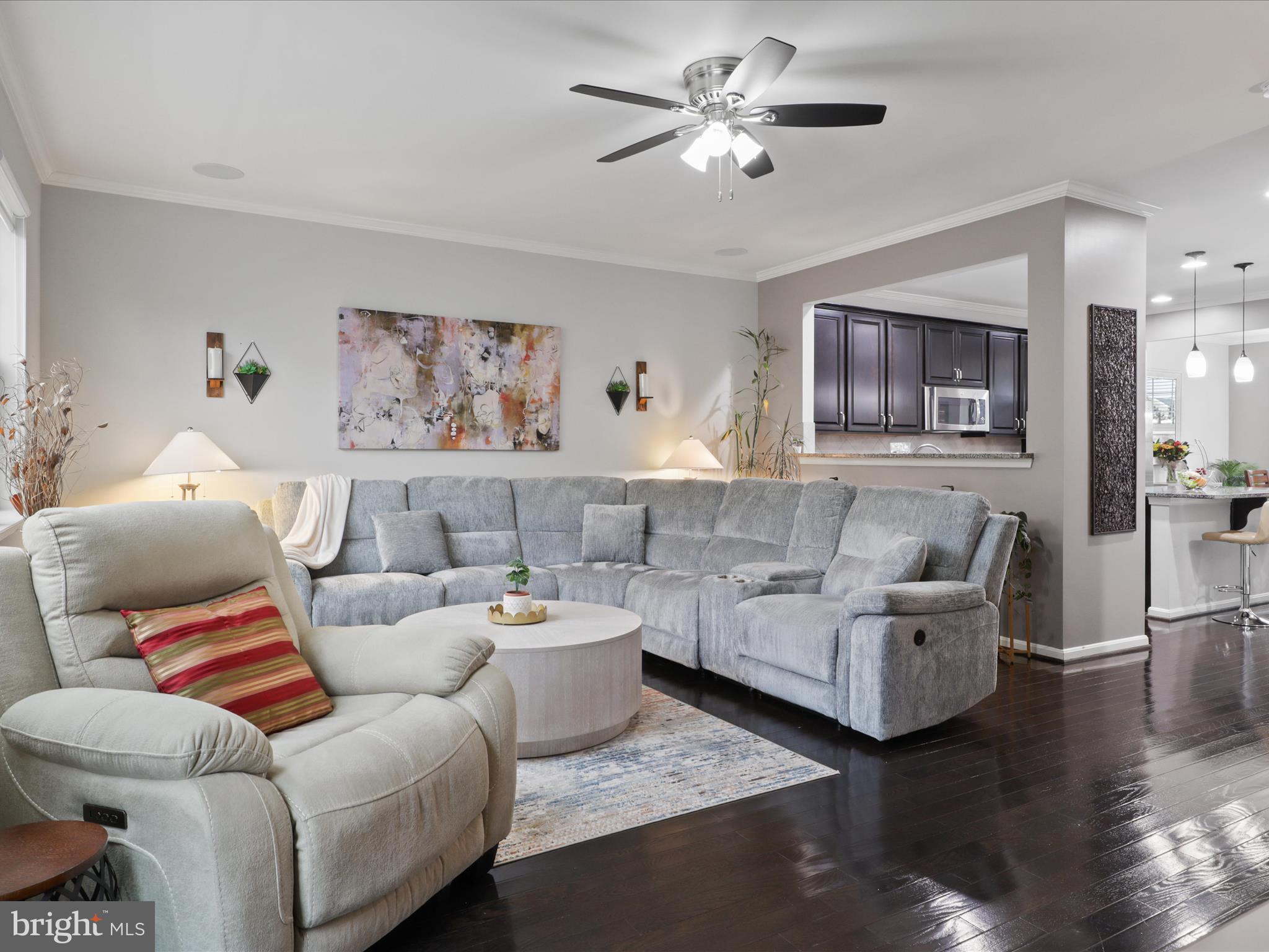 16006 Madison Ridge Place Gainesville, VA 20155 - Photo 13 of 48 a living room with furniture and wooden floor