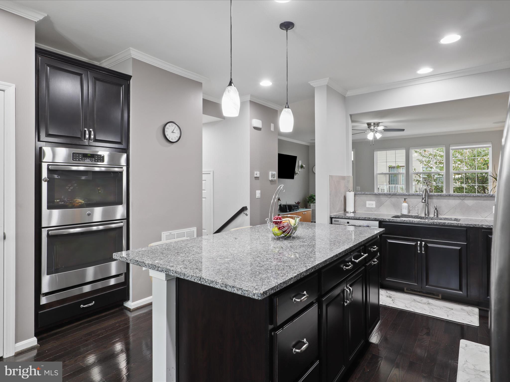 16006 Madison Ridge Place Gainesville, VA 20155 - Photo 16 of 48 a kitchen with a sink a counter space appliances and cabinets