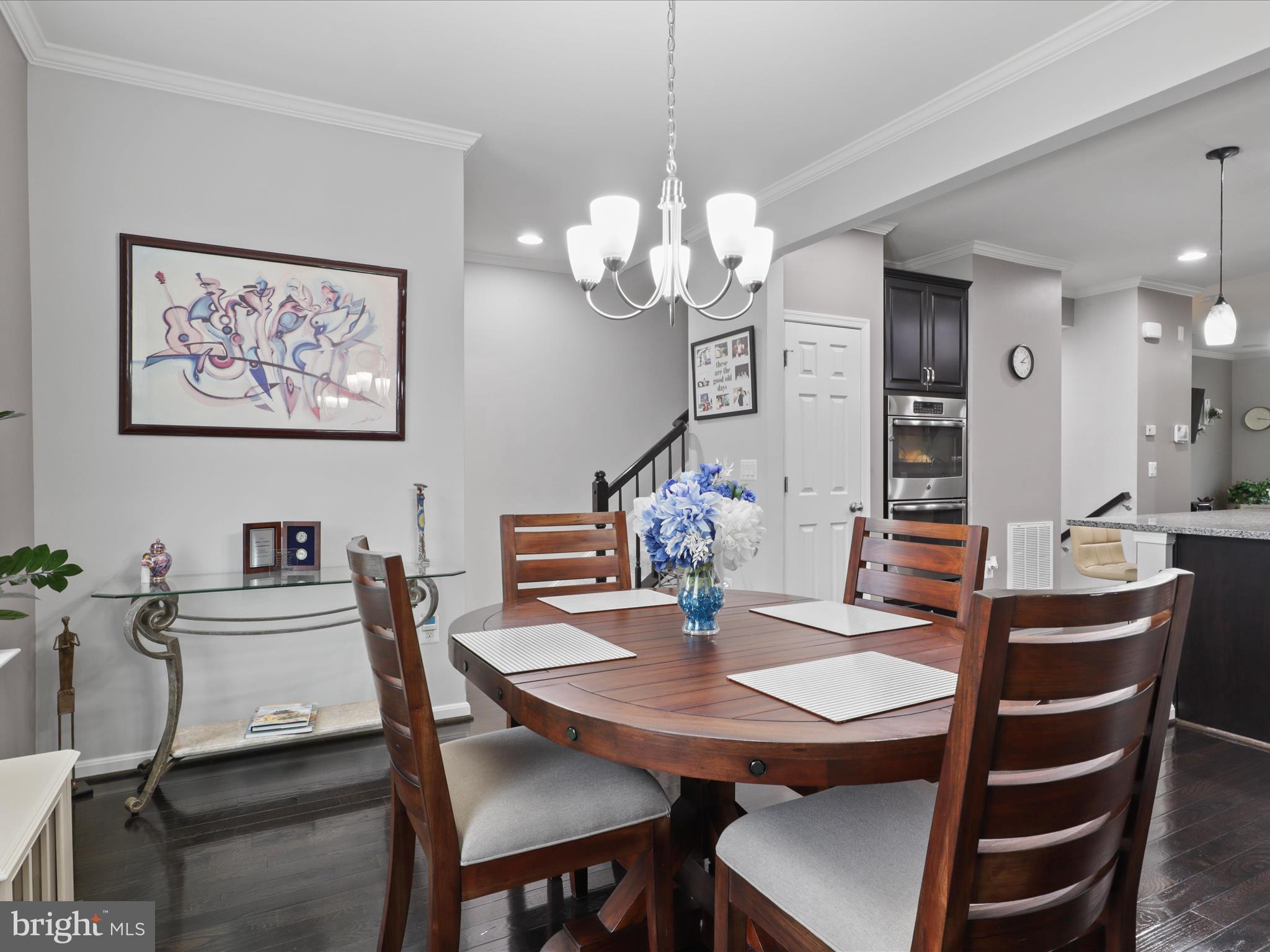 16006 Madison Ridge Place Gainesville, VA 20155 - Photo 20 of 48 a view of a dining room with a table and chairs