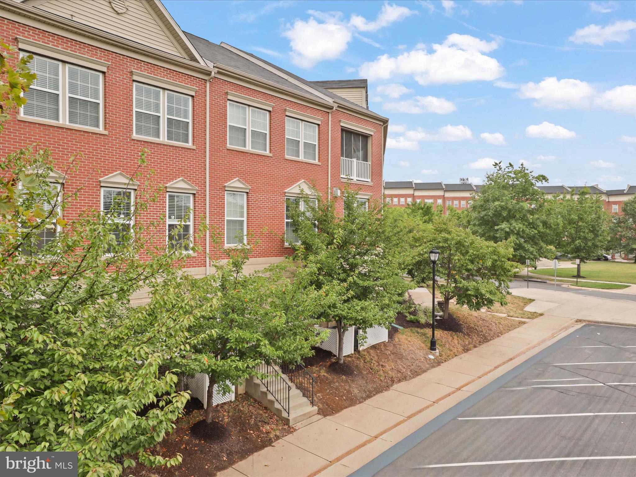 16006 Madison Ridge Place Gainesville, VA 20155 - Photo 2 of 48 a view of a building with potted plants