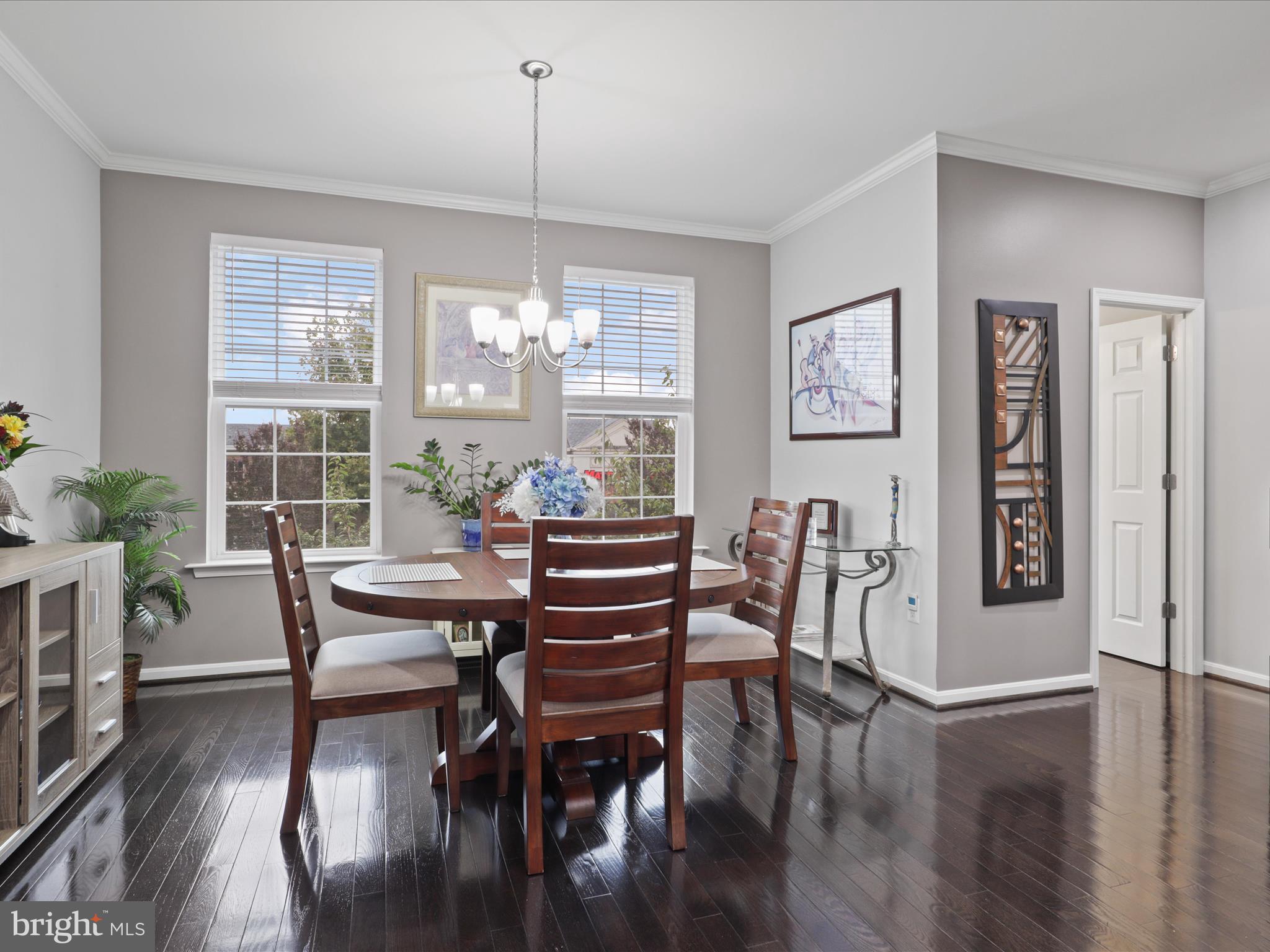 16006 Madison Ridge Place Gainesville, VA 20155 - Photo 21 of 48 a view of a dining room with furniture window and wooden floor