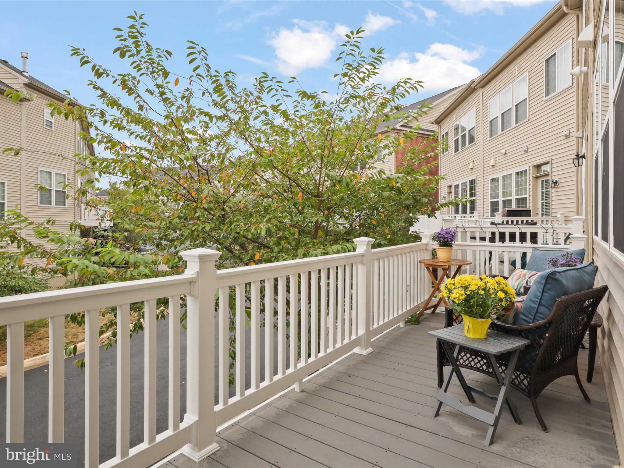 16006 Madison Ridge Place Gainesville, VA 20155 - Photo 22 of 48 a view of a chairs and table on the deck