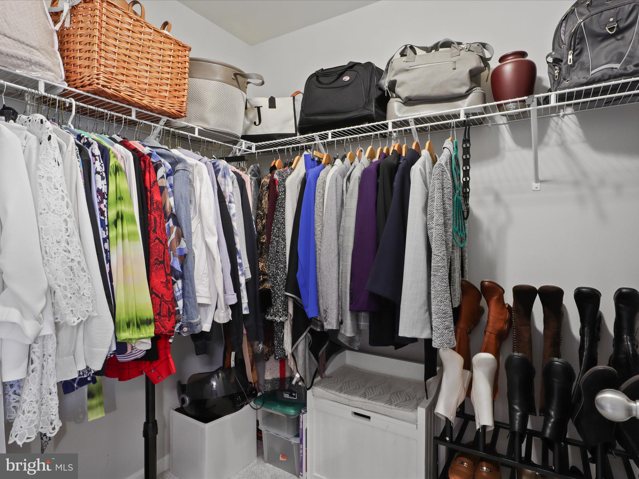 16006 Madison Ridge Place Gainesville, VA 20155 - Photo 27 of 48 a view of walk in closet with clothes and shoes