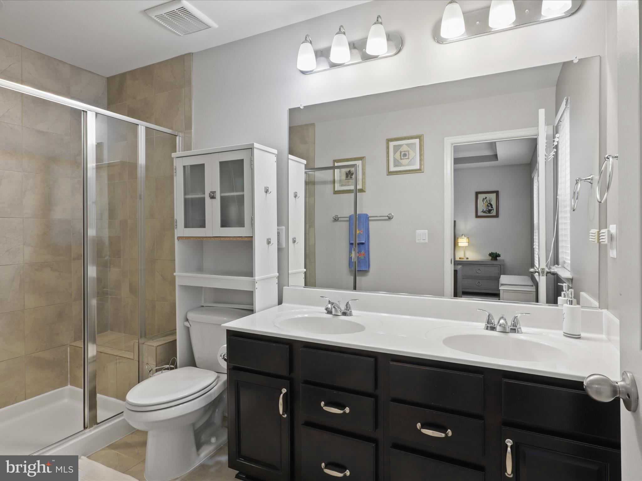 16006 Madison Ridge Place Gainesville, VA 20155 - Photo 28 of 48 a bathroom with a sink toilet and shower