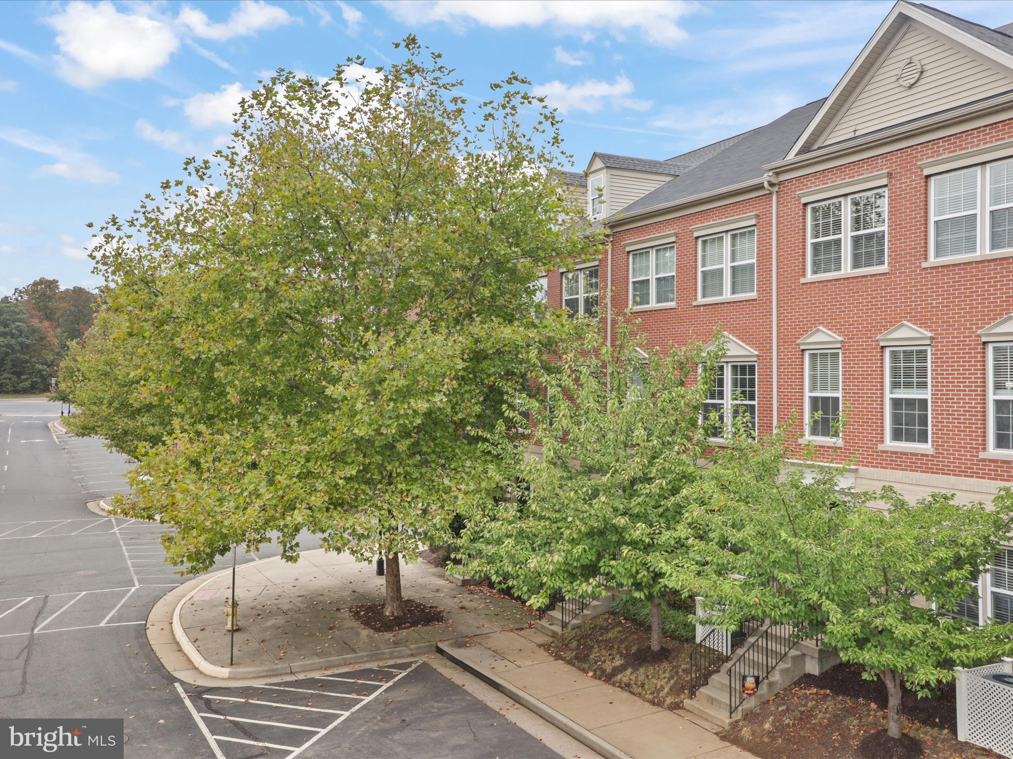 16006 Madison Ridge Place Gainesville, VA 20155 - Photo 3 of 48 a view of a backyard with table and chairs and potted plants