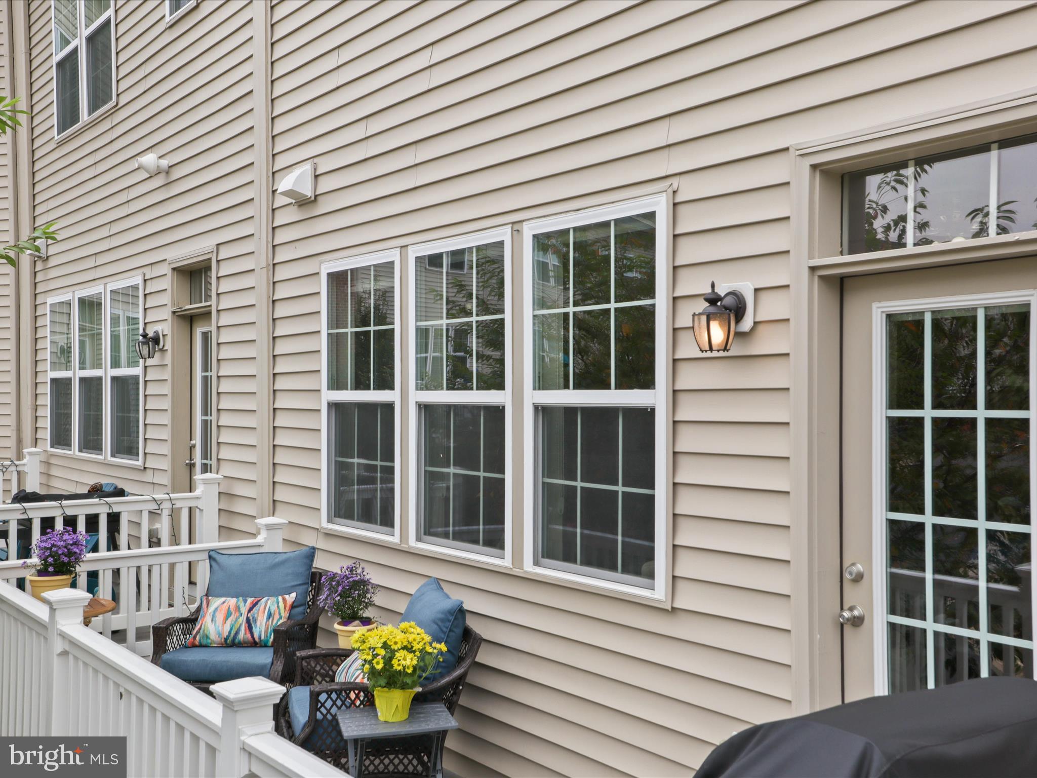 16006 Madison Ridge Place Gainesville, VA 20155 - Photo 33 of 48 a view of a house with outdoor seating
