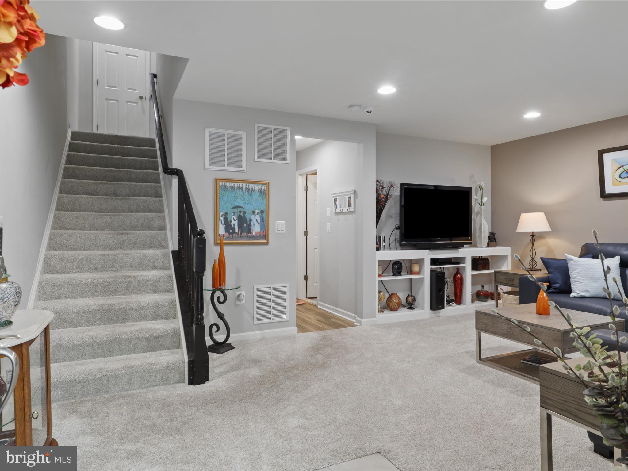 16006 Madison Ridge Place Gainesville, VA 20155 - Photo 5 of 48 a view of a livingroom with furniture and a flat screen tv