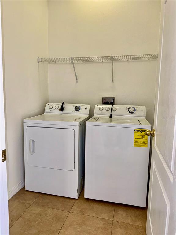 6404 South Goldenrod Road, Unit 2A Orlando, FL 32822 - Photo 21 of 40 a utility room with dryer and washer