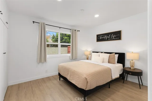 a bedroom with a bed and window