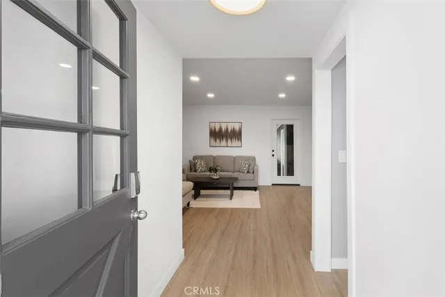 a view of a living room and entry way