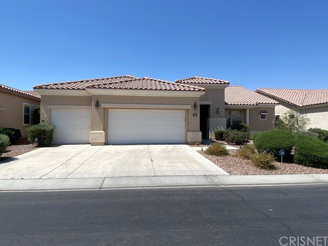 a front view of a house with a garage