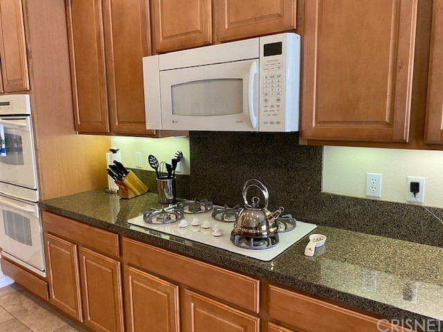 80278 Camino San Mateo Indio, CA 92203 - Photo 13 of 63 a kitchen with sink a microwave and cabinets
