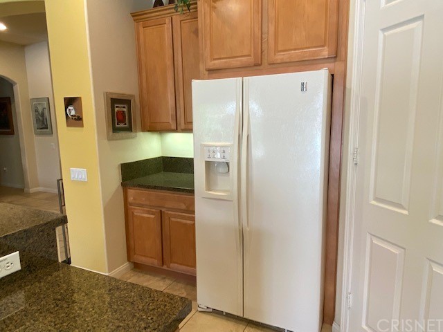 80278 Camino San Mateo Indio, CA 92203 - Photo 18 of 63 a white refrigerator freezer sitting inside of a kitchen